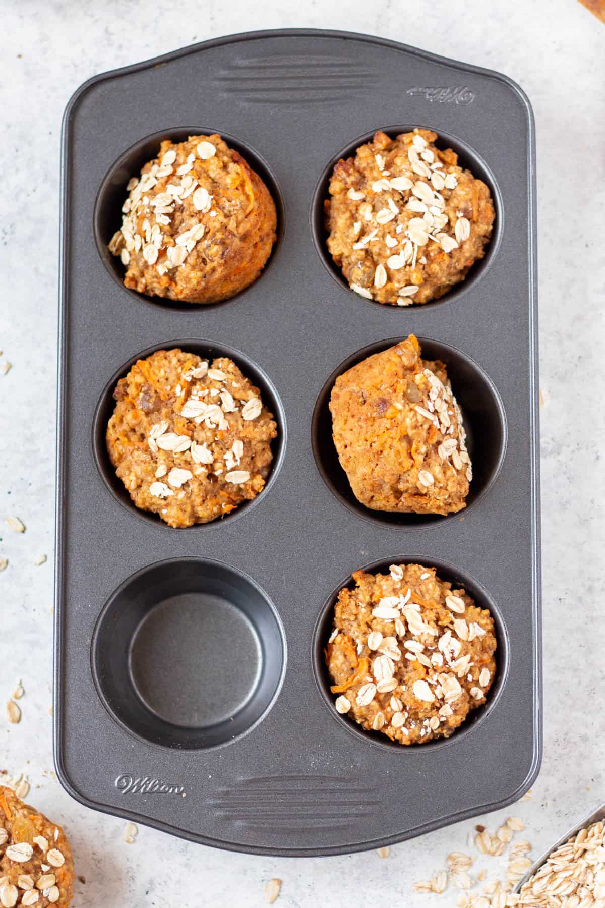 carrot muffins in a muffin tin