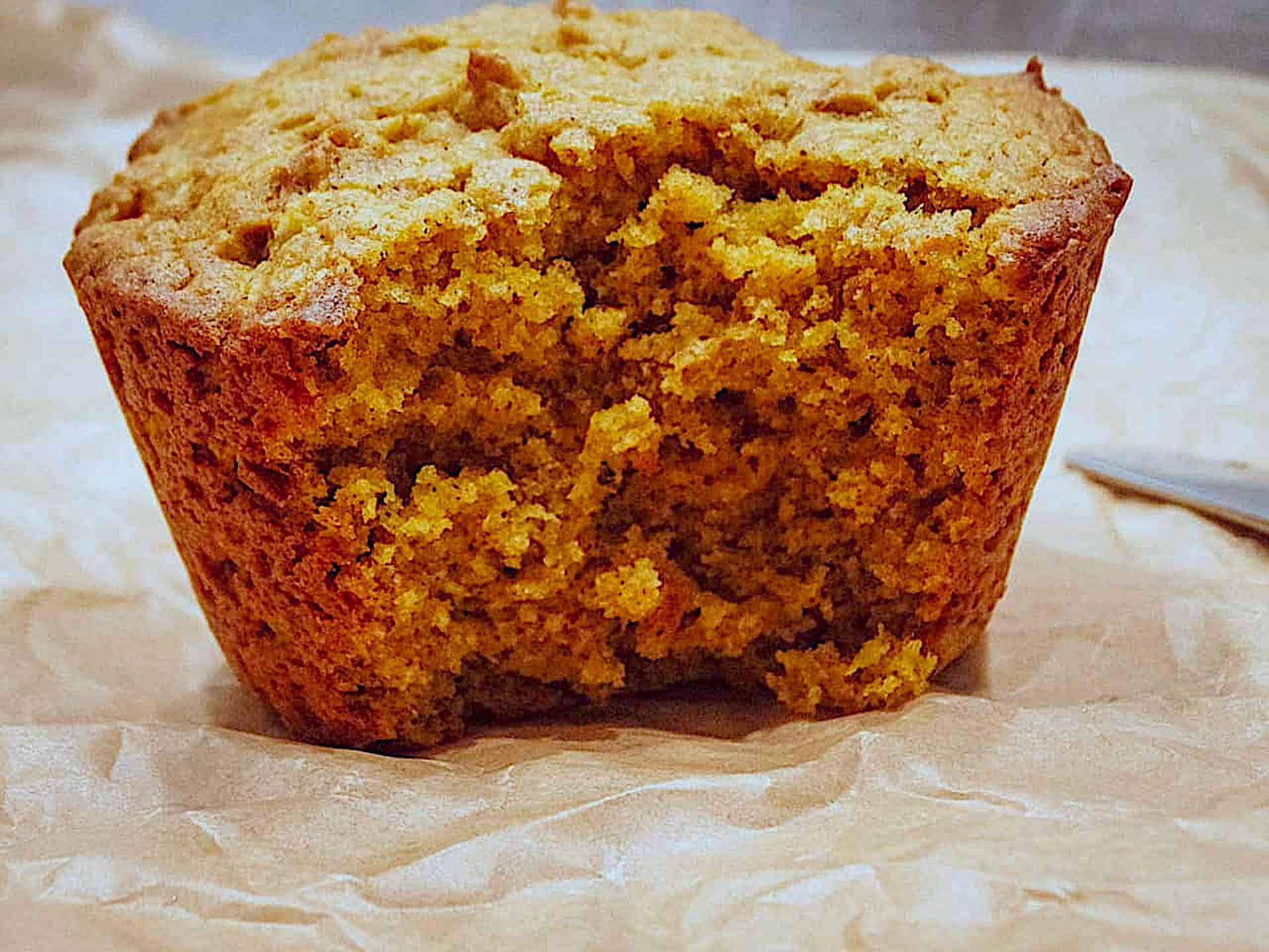 pumpkin spice muffin on parchment paper