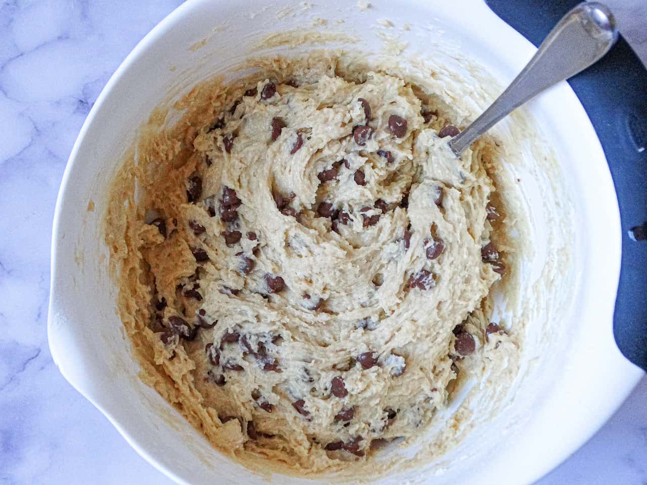 almond milk chocolate chip muffin batter in a mixing bowl