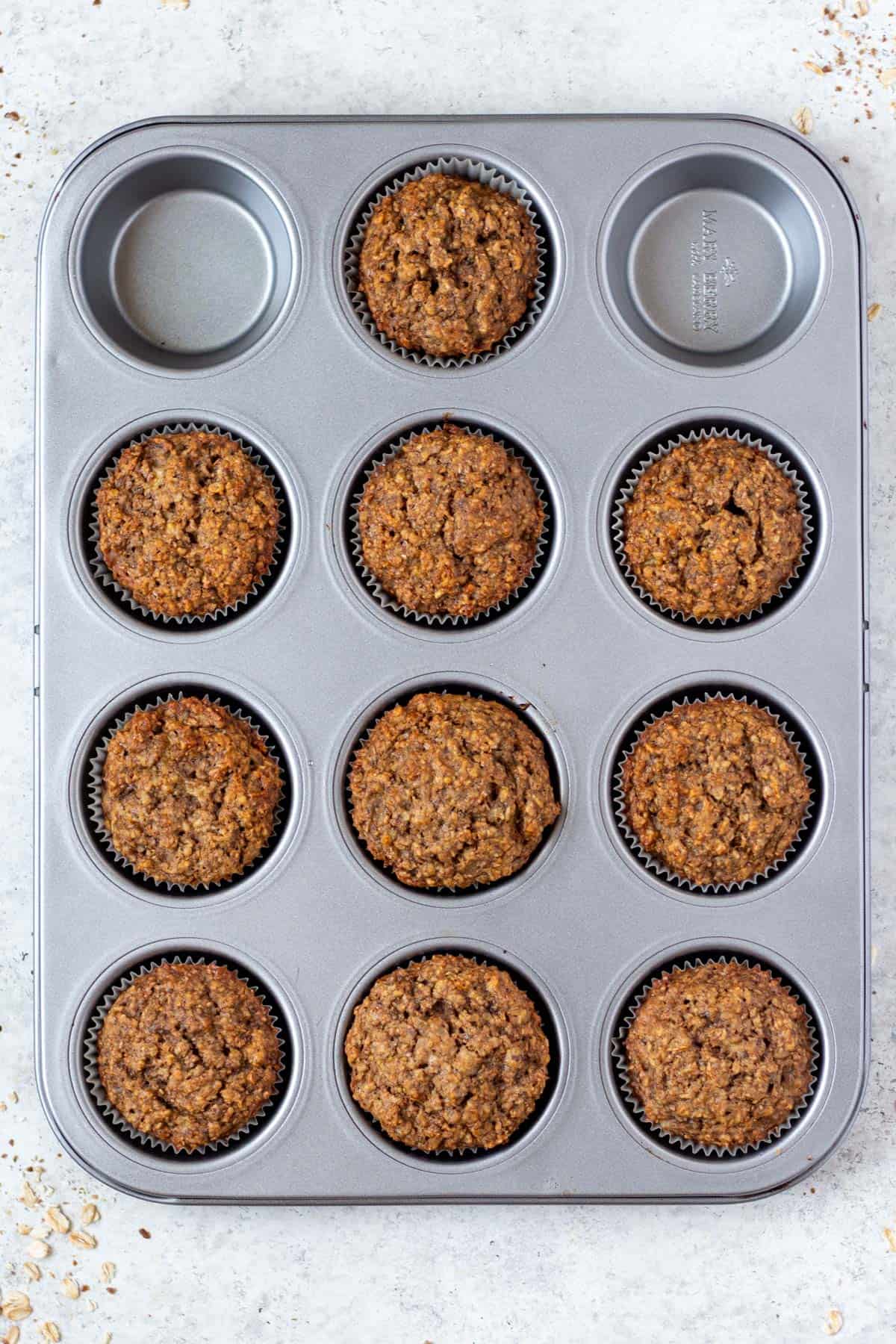 cooked flaxseed muffins in a muffin tin