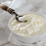 homemade greek yogurt in a white bowl