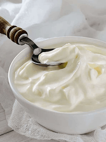 homemade greek yogurt in a white bowl