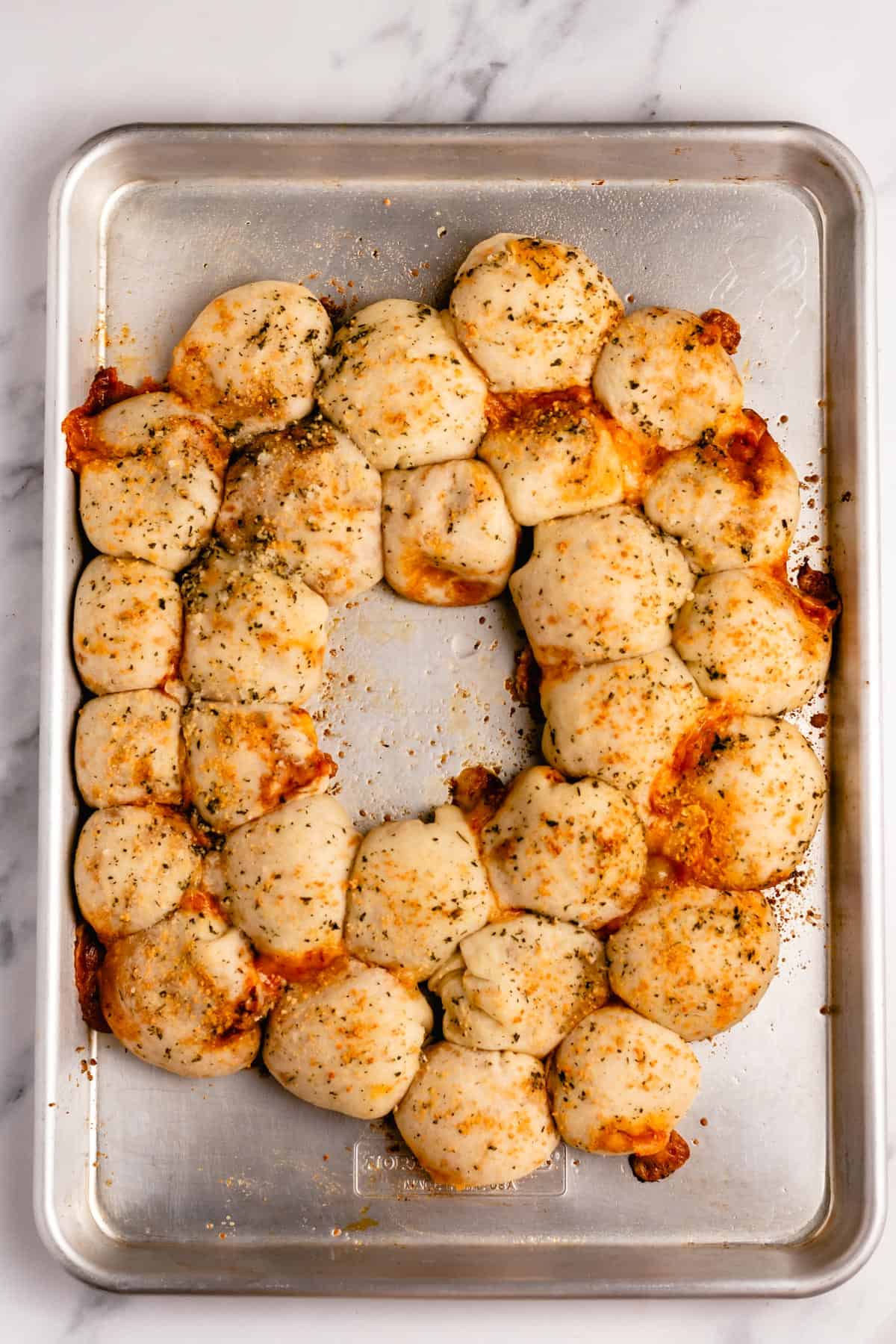 baked pizza poppers on a baking sheet