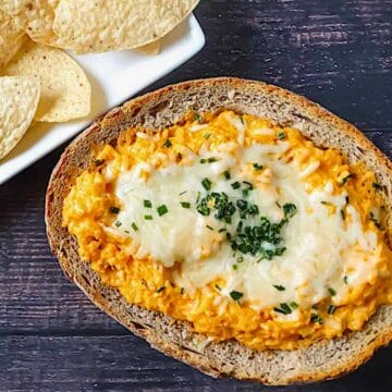 buffalo cauliflower dip in a bread bowl