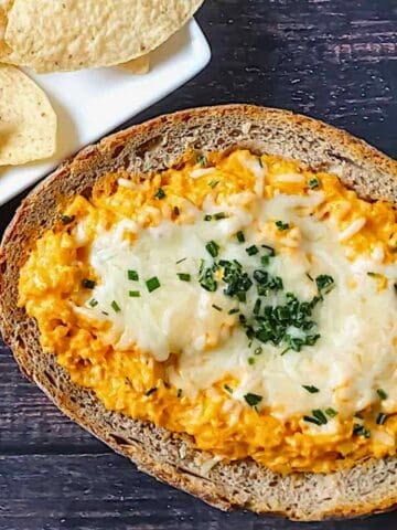 buffalo cauliflower dip in a bread bowl