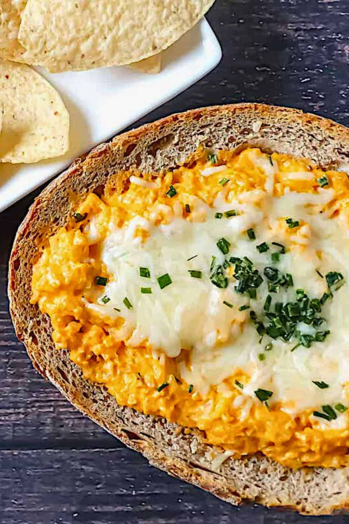buffalo cauliflower dip in a bread bowl