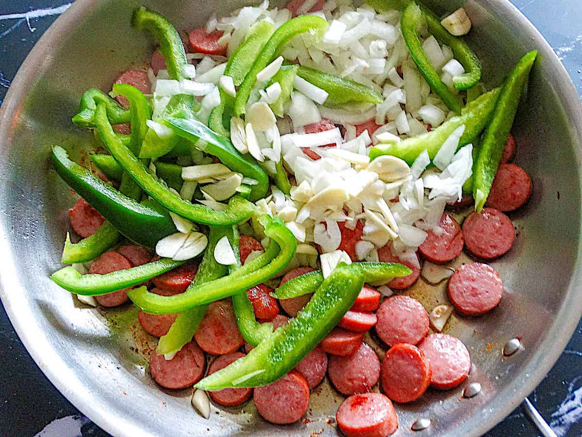 kielbasa, peppers, onions, and garlic diced and in a frying pan