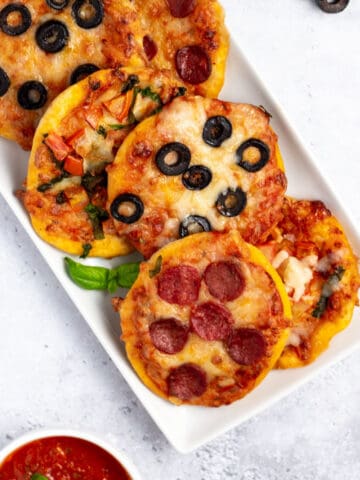 mini pizzas on a white serving plate