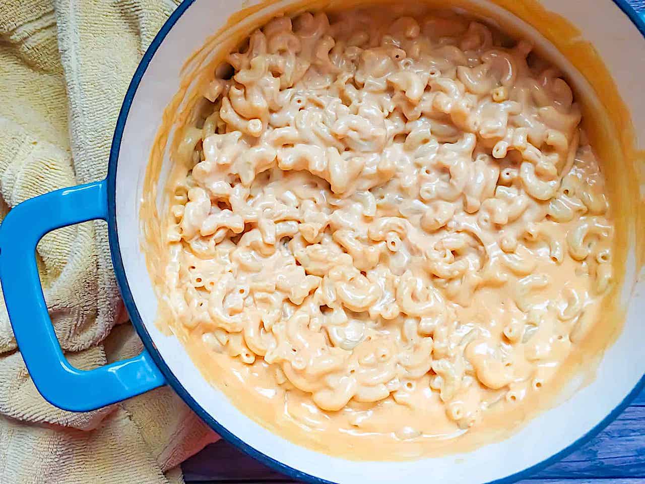 homemade creamy mac and cheese in a blue dutch oven
