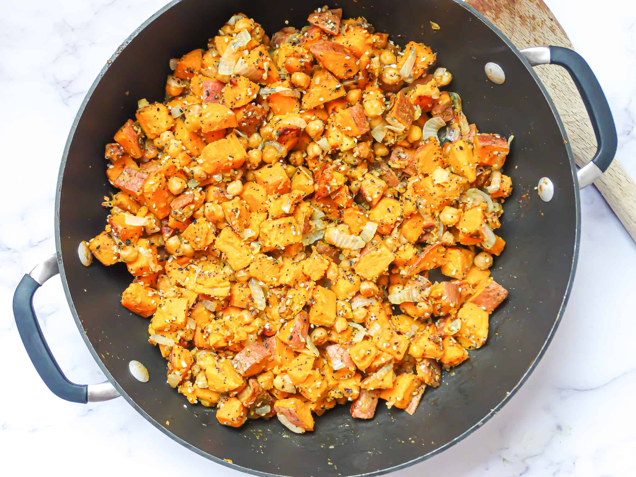 sweet potato chickpea hash in a large wok
