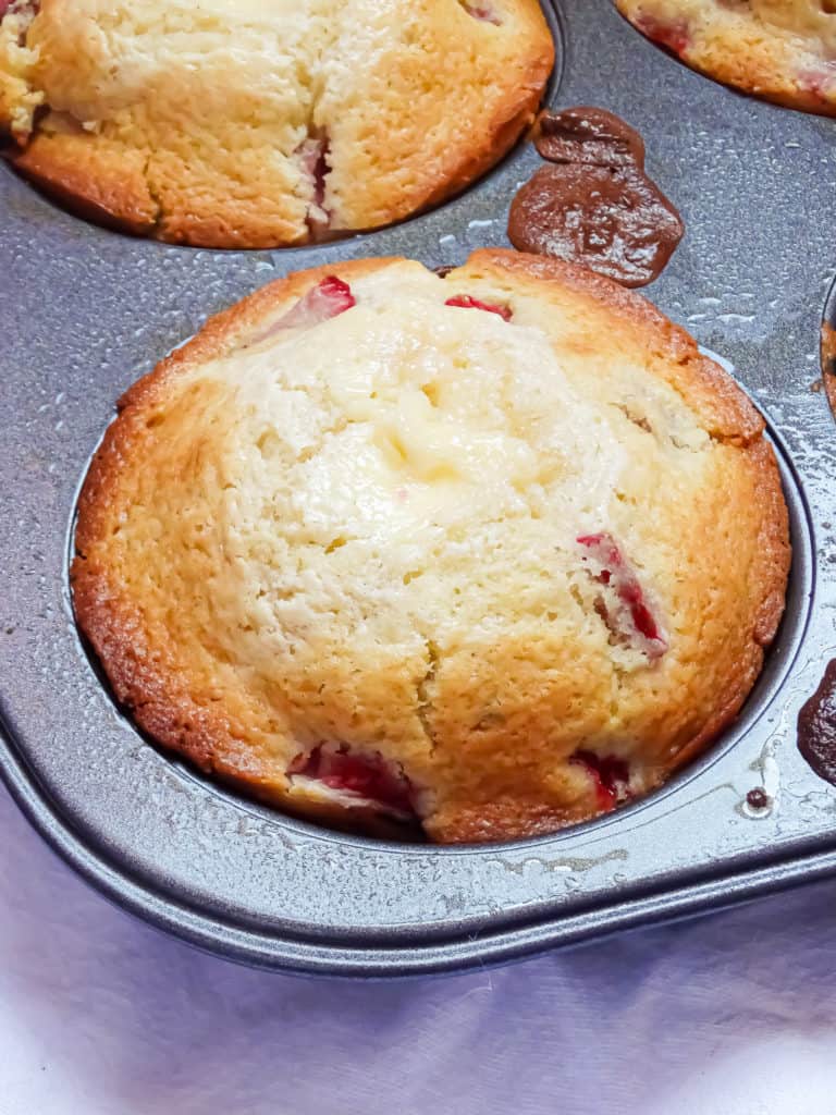 strawberry cheesecake muffins in a jumbo muffin tin