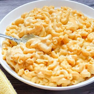 ultra creamy homemade mac and cheese in a white bowl