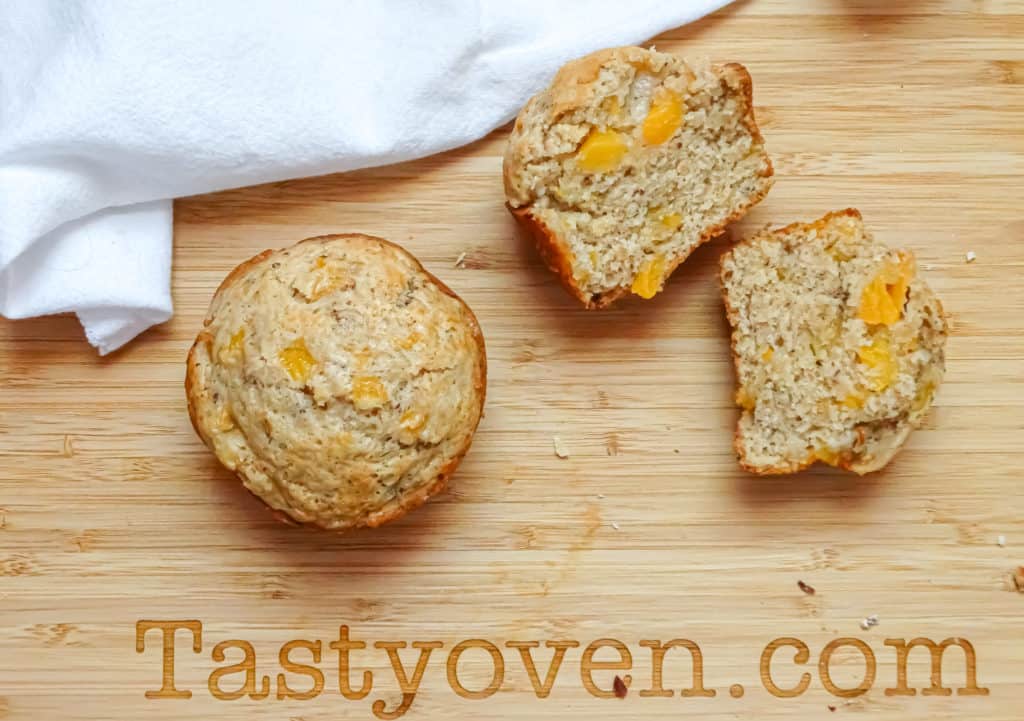 peach muffins made with flax eggs on a cutting board