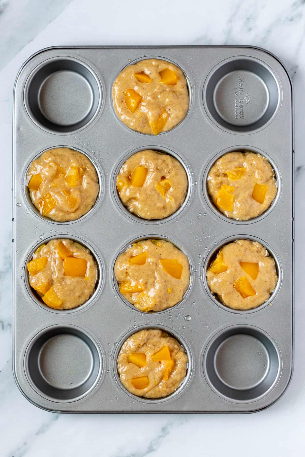 uncooked batter in muffin tray