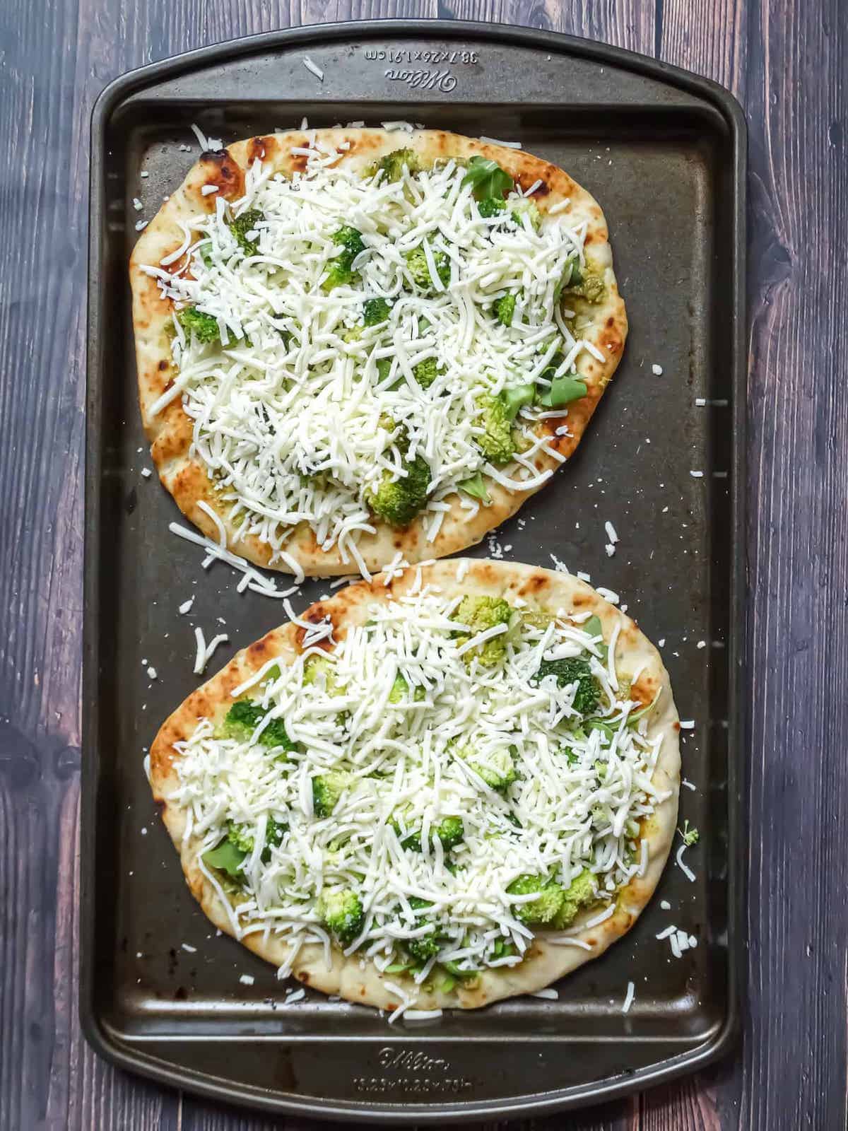 flatbreads topped with broccoli, arugula and mozzarella cheese