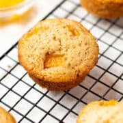 peach muffin on a cooling rack