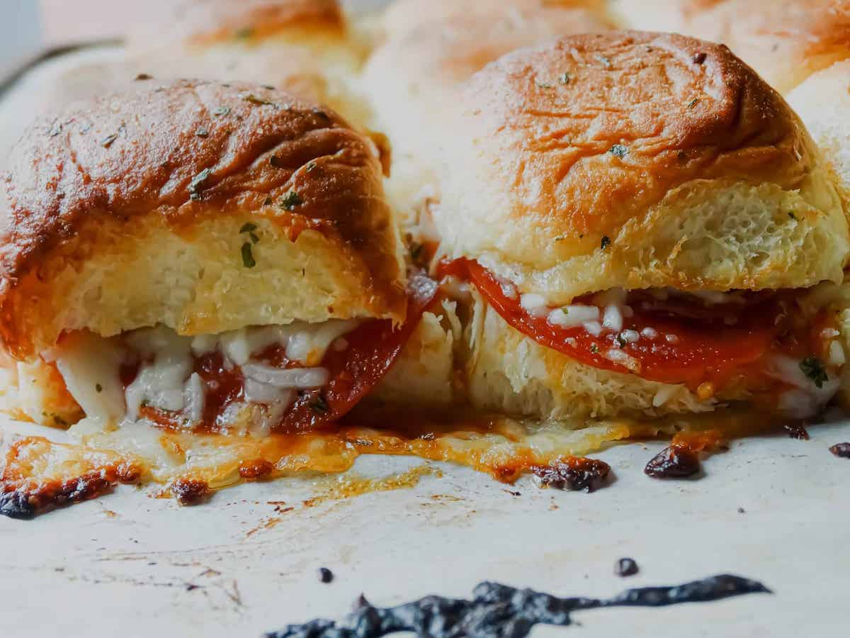 pepperoni pizza sliders close up on a baking sheet