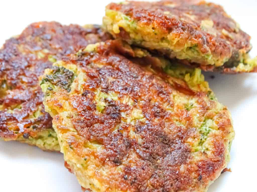 broccoli cheddar fritters on a white plate