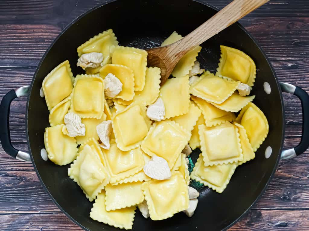 ravioli and chicken in a wok