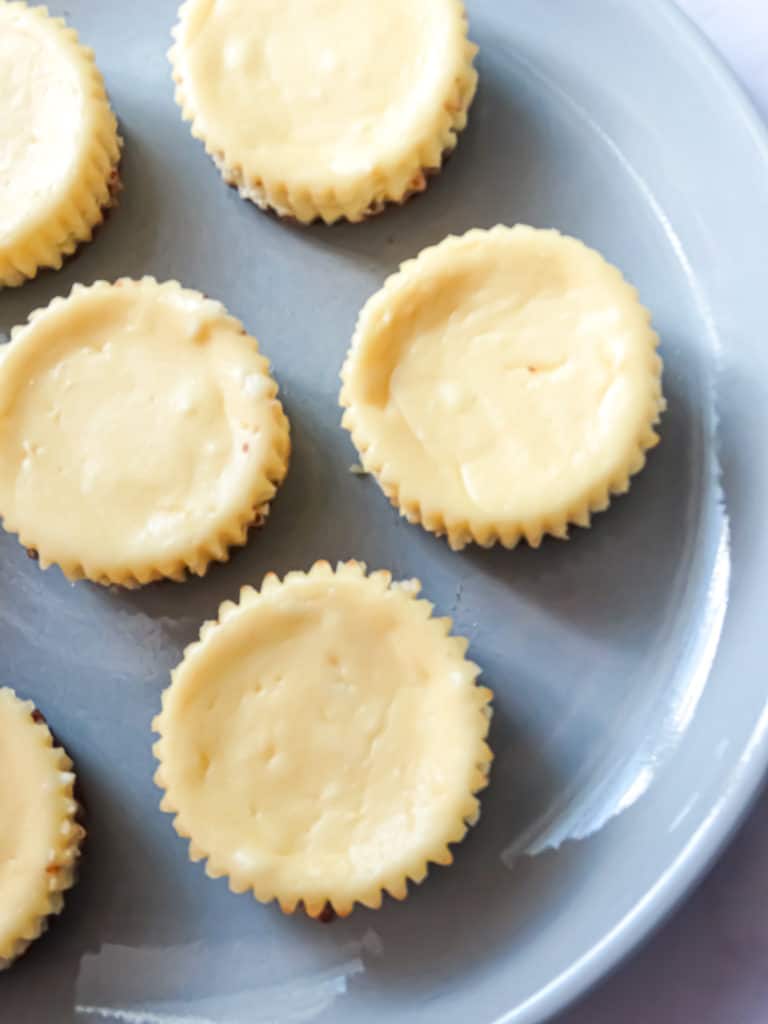 mini cheesecakes on a grey plate, plain
