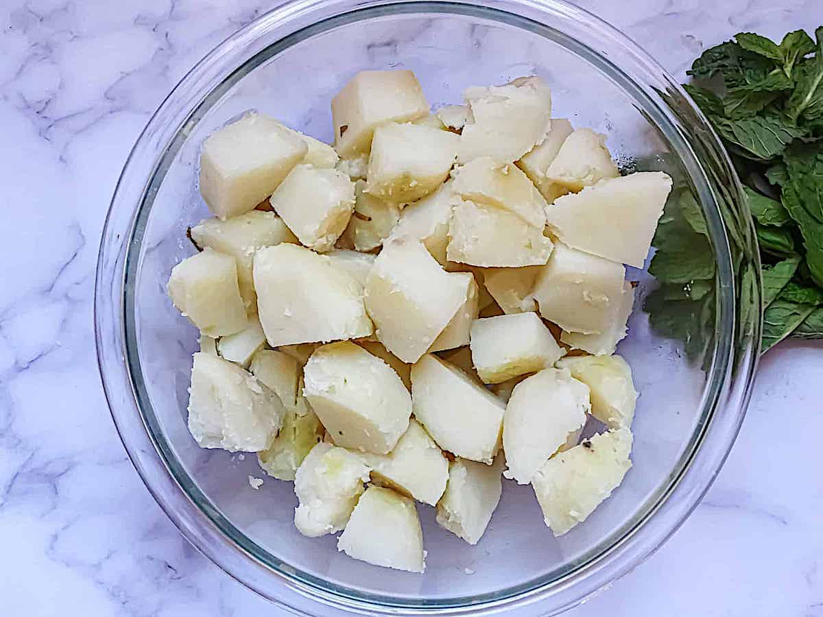 boiled potatoes cut into cubes in a clear bowl