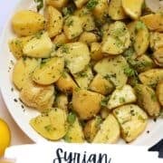 syrian potato salad in a white bowl