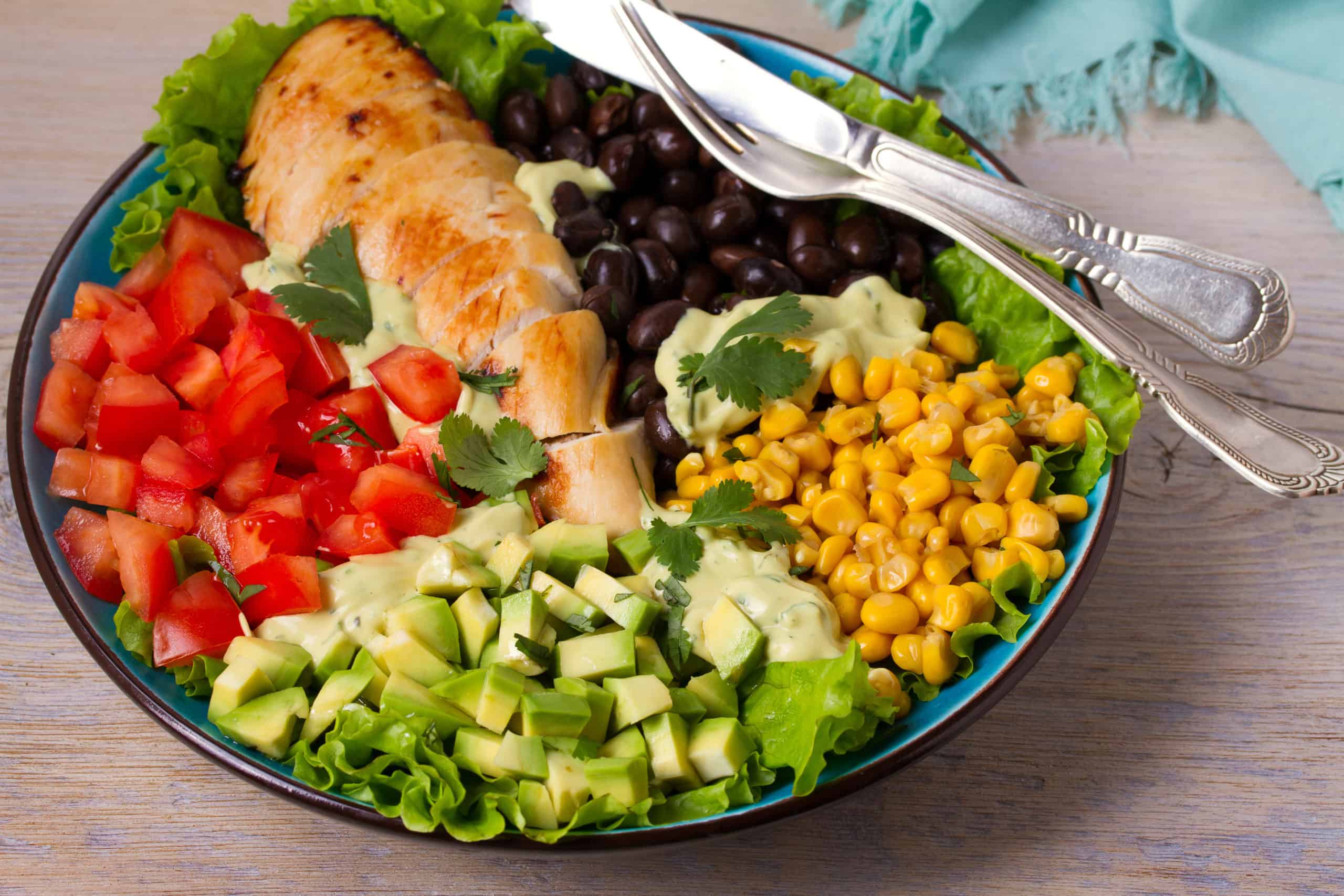 grilled chicken salad in a large bowl