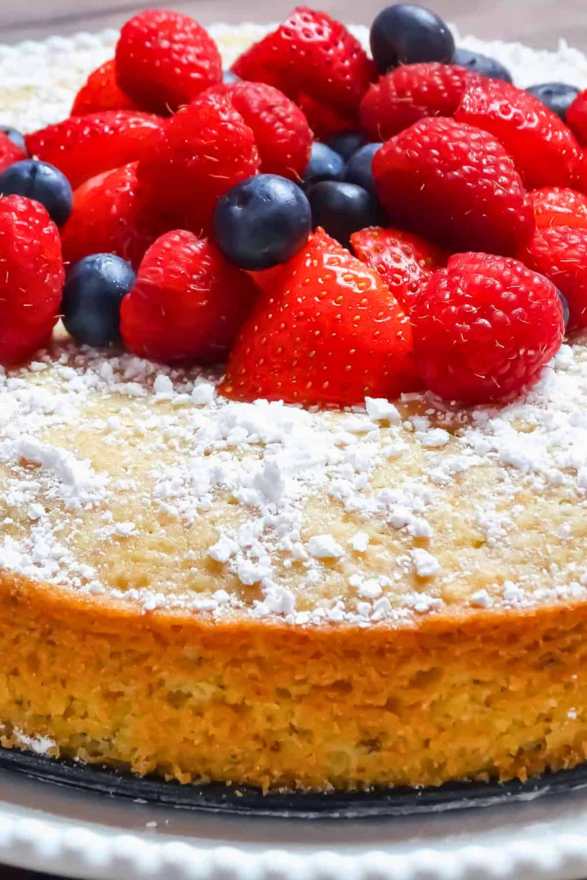 lemon olive oil cake topped with berries