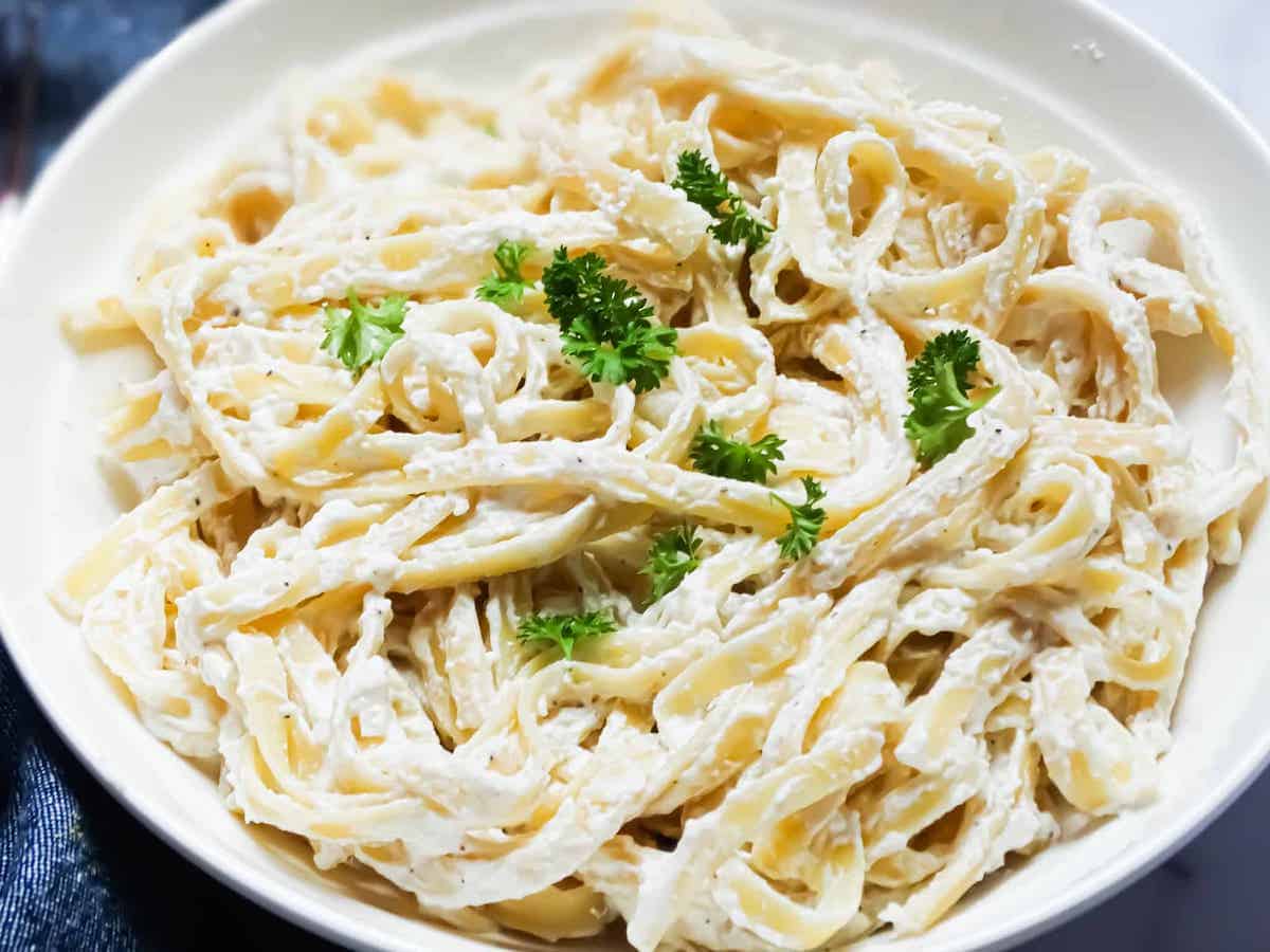 lemon ricotta pasta in a bowl with parsley