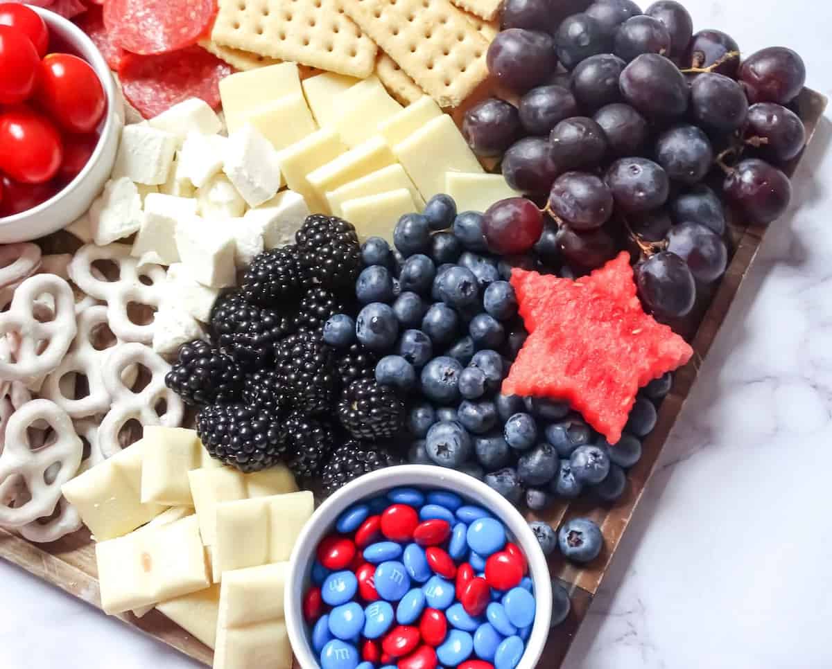 blue foods on a red, white and blue snack board