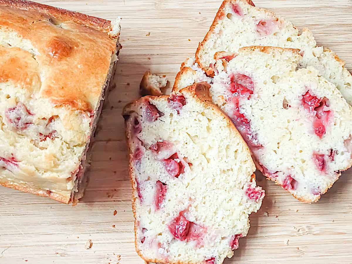 sliced strawberry lemon bread on a cutting board