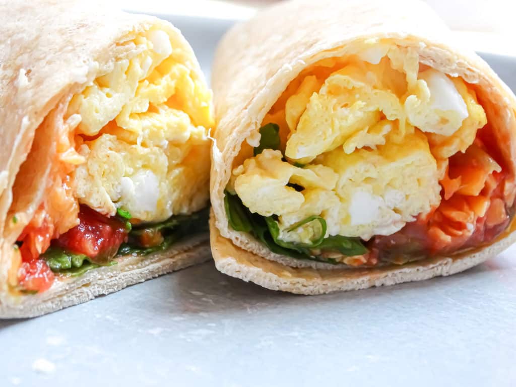 inside of a spinach egg breakfast burrito; a healthy breakfast idea for the family