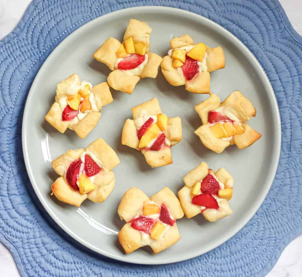 mini croissant cups filled with danish cream filling and strawberry and peach