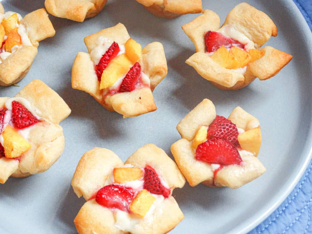mini croissant cups filled with danish cream filling and strawberry and peach