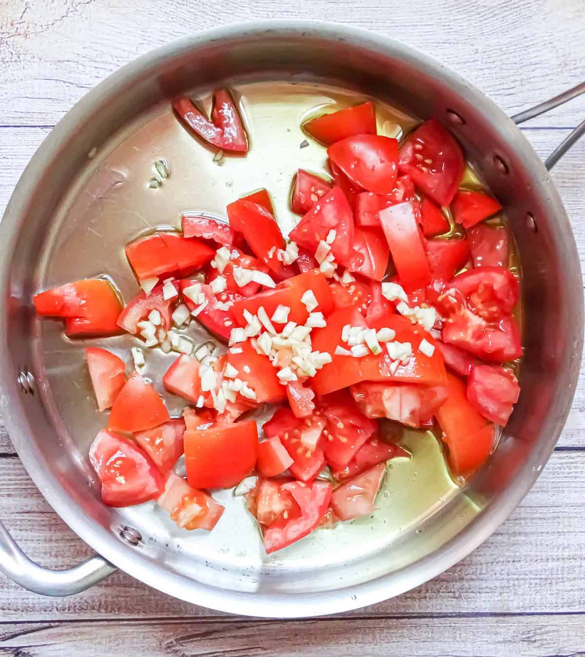 tomato and garlic in a pan