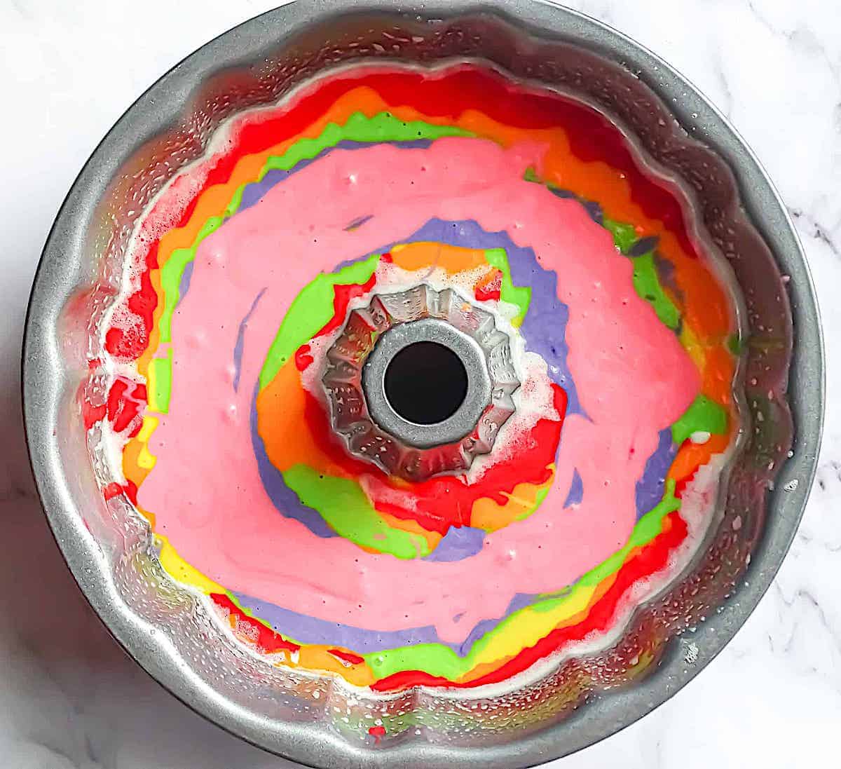 rainbow batter in a bundt pan
