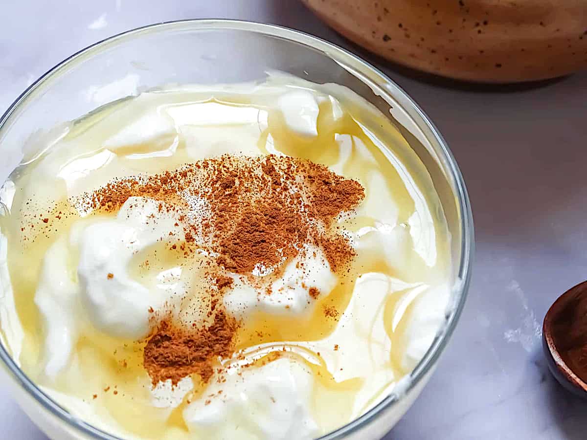 honey, cinnamon and yogurt in a glass bowl