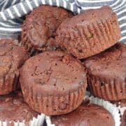 double chocolate zucchini muffins in a pile