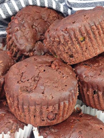 double chocolate zucchini muffins in a pile