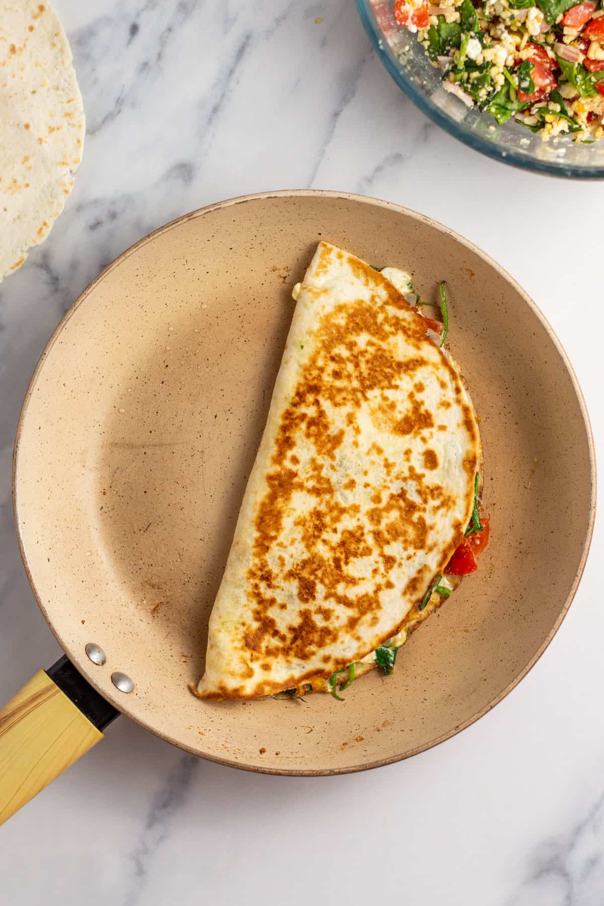 pan fried quesadilla in a frying pan cooked