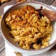 baked pumpkin oatmeal in a white bowl