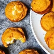pumpkin cream cheese muffins on a cooling rack