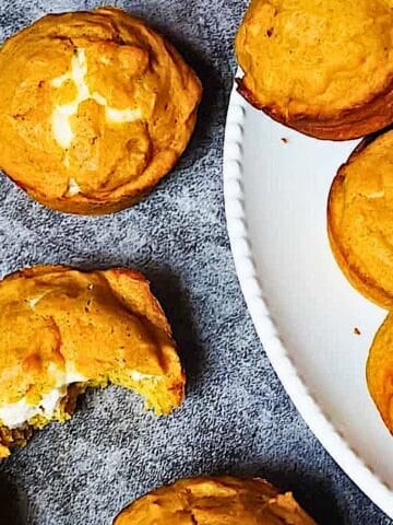 pumpkin cream cheese muffins on a cooling rack