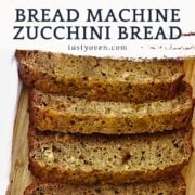 zucchini bread sliced on a cutting board