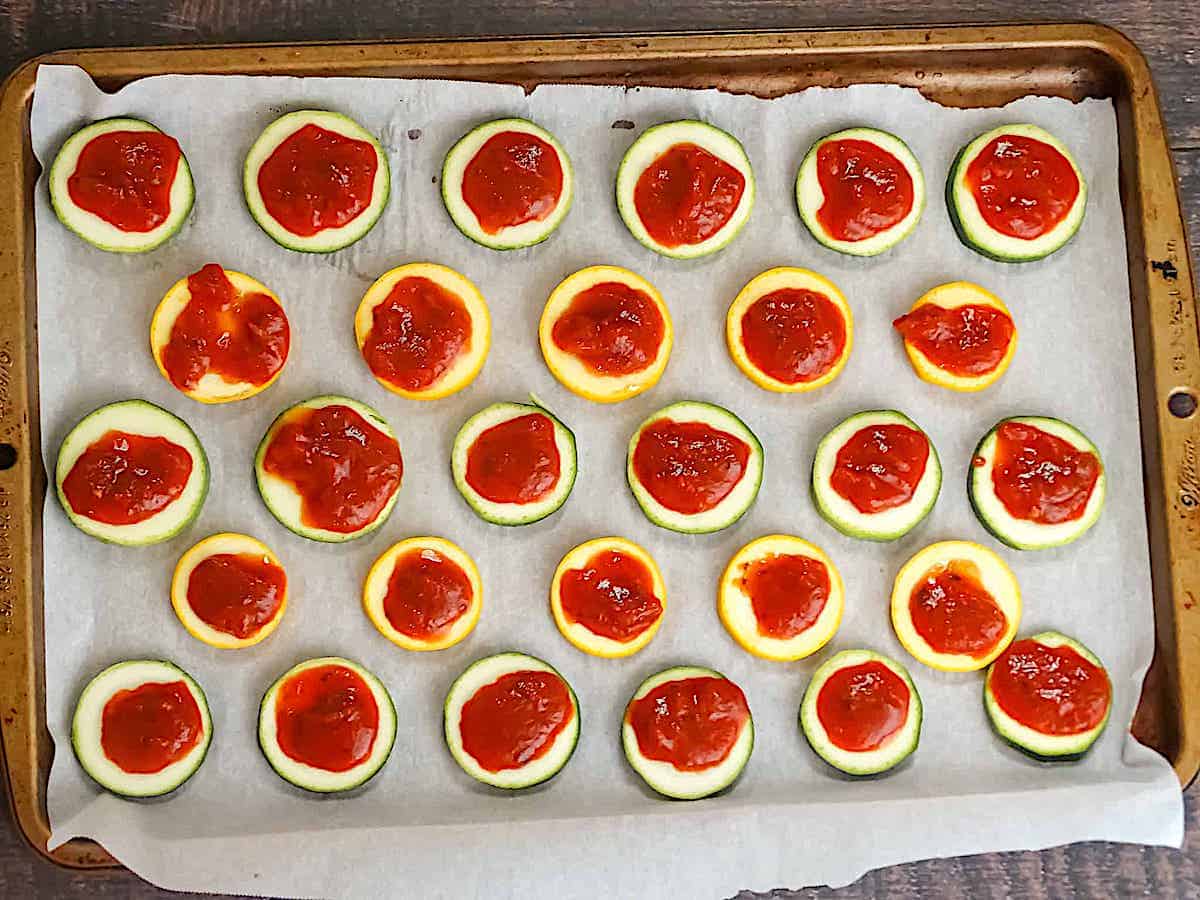 zucchini slices topped with pizza sauce