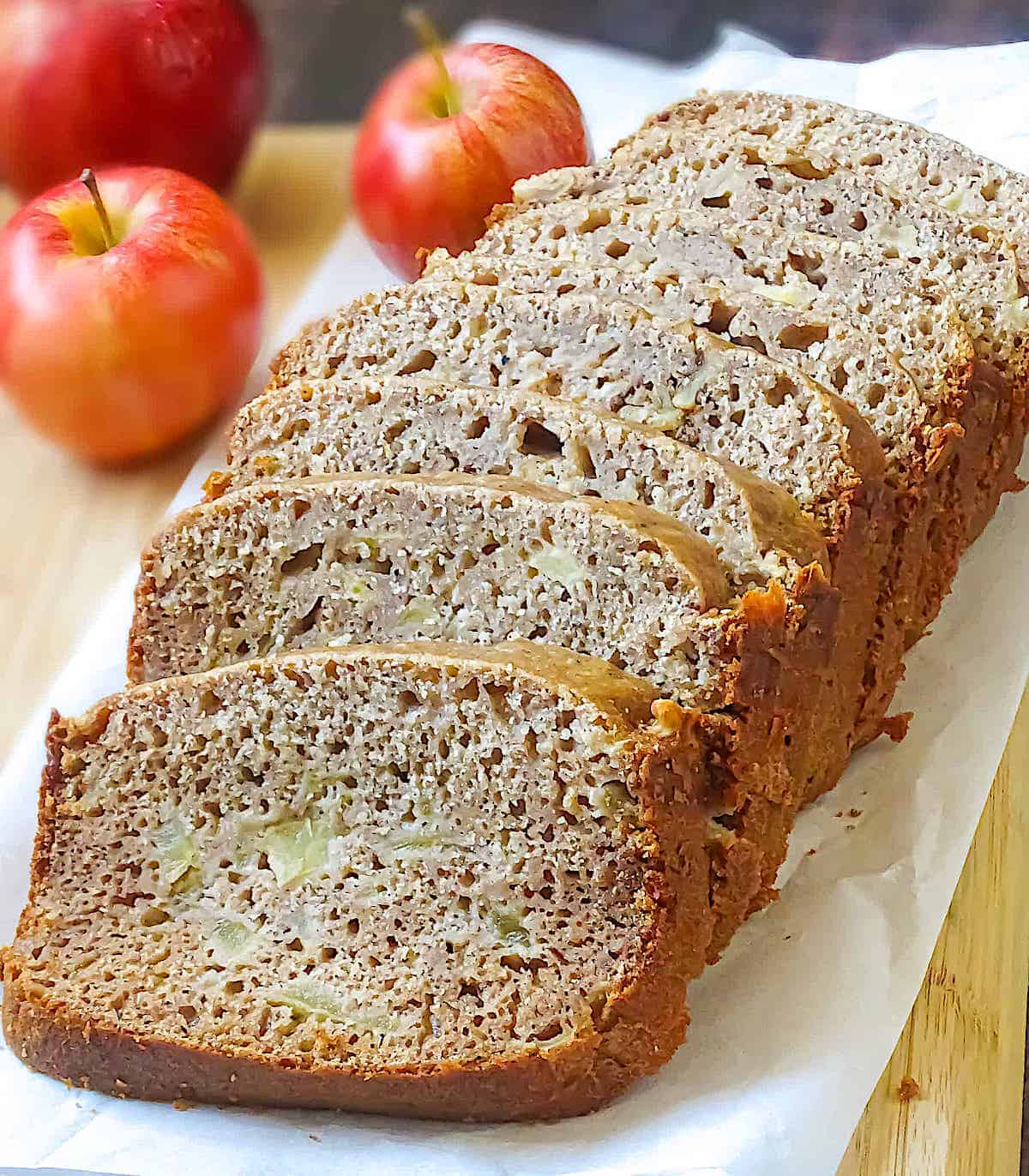 bread machine apple bread sliced on a cutting board