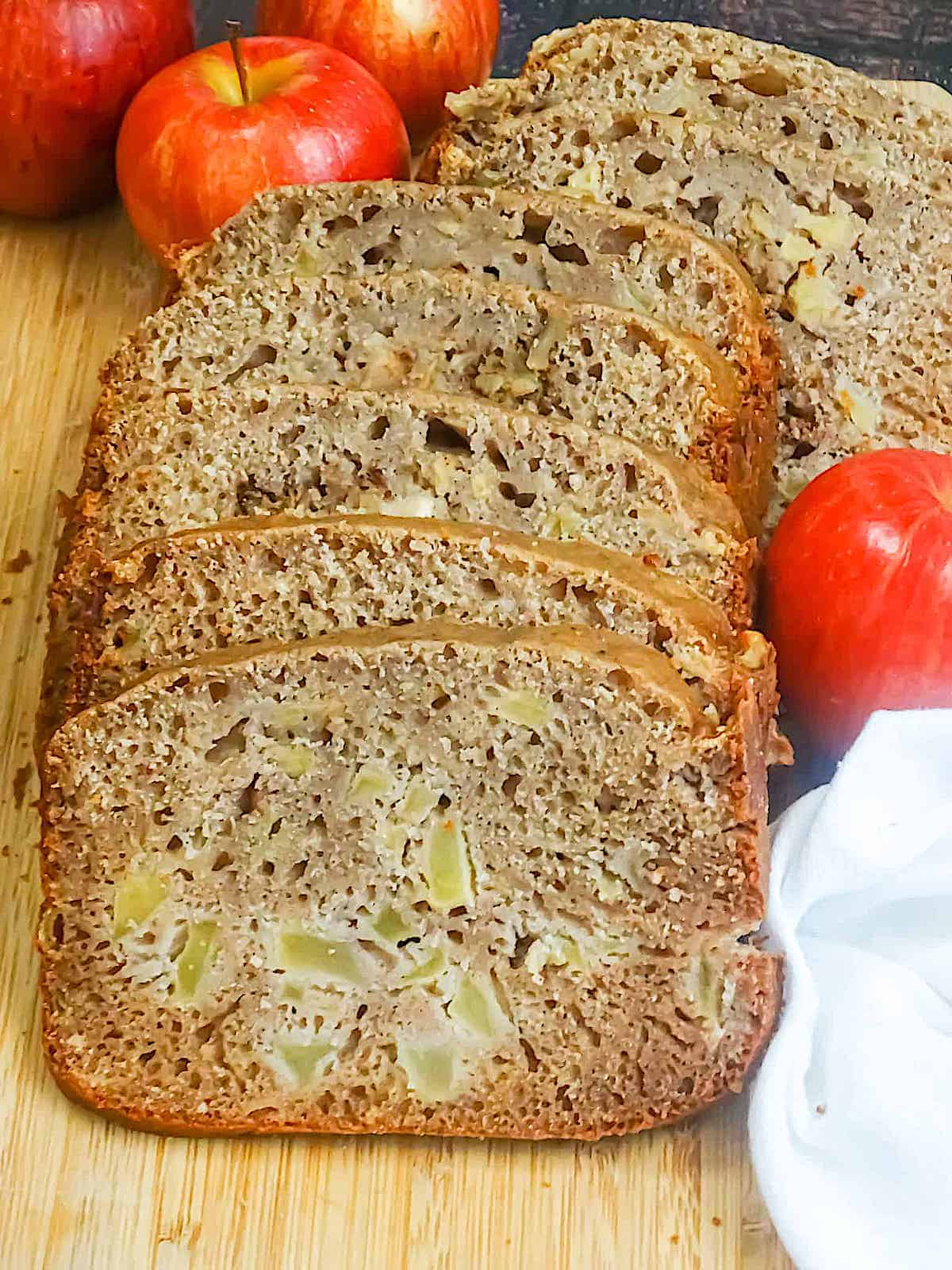 bread machine apple bread sliced on a cutting board