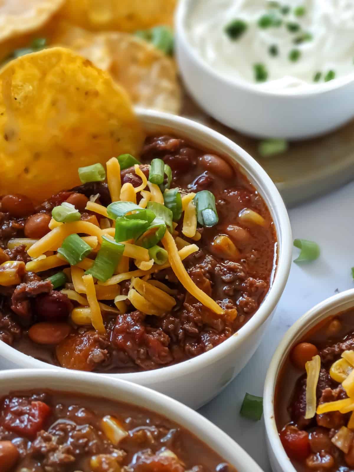 instant pot chili with a tortilla chip for dipping