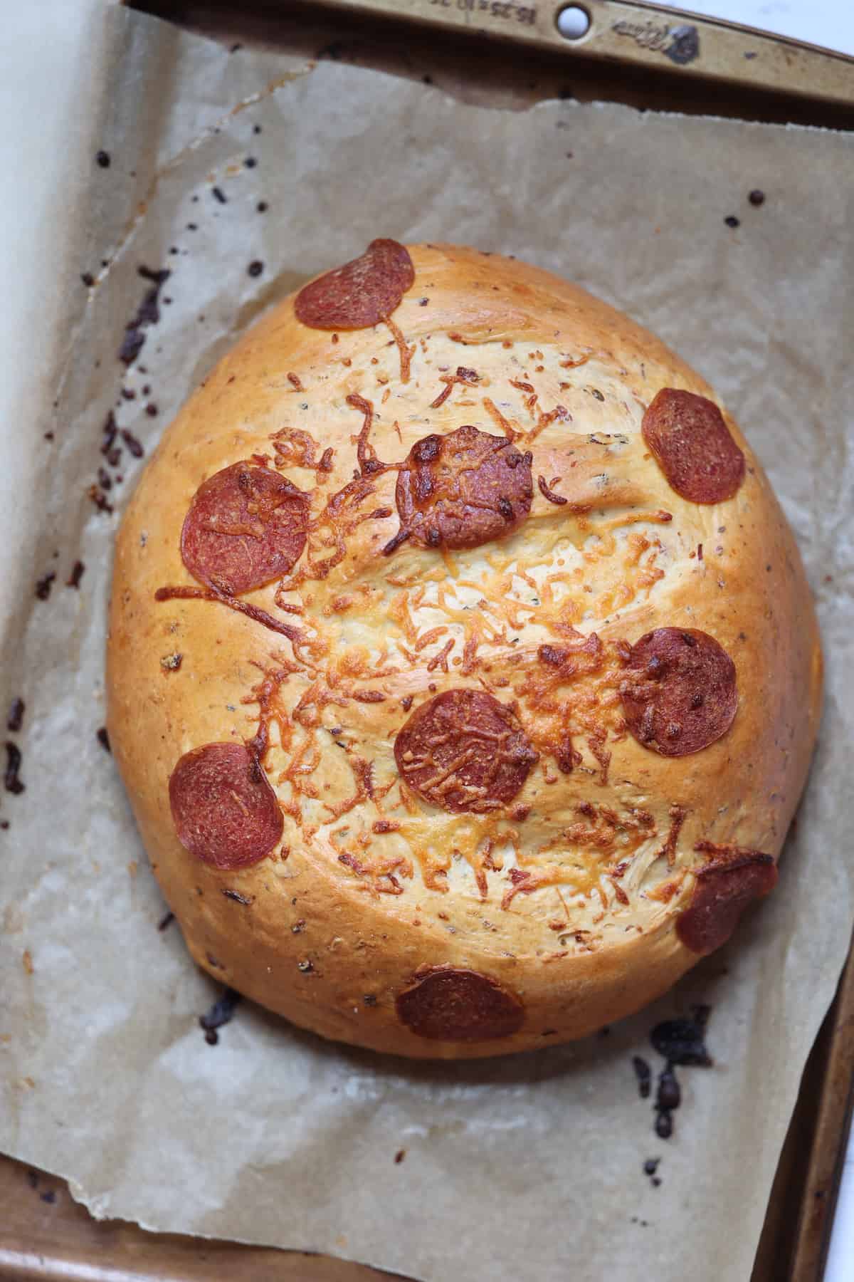 baked pepperoni bread on a cookie sheet