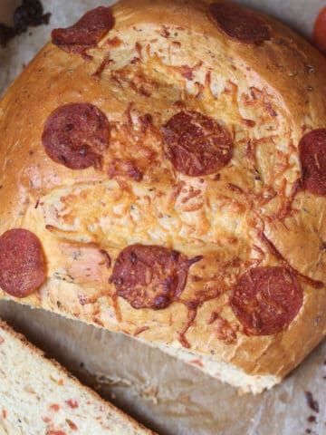 pepperoni bread sliced on a cutting board